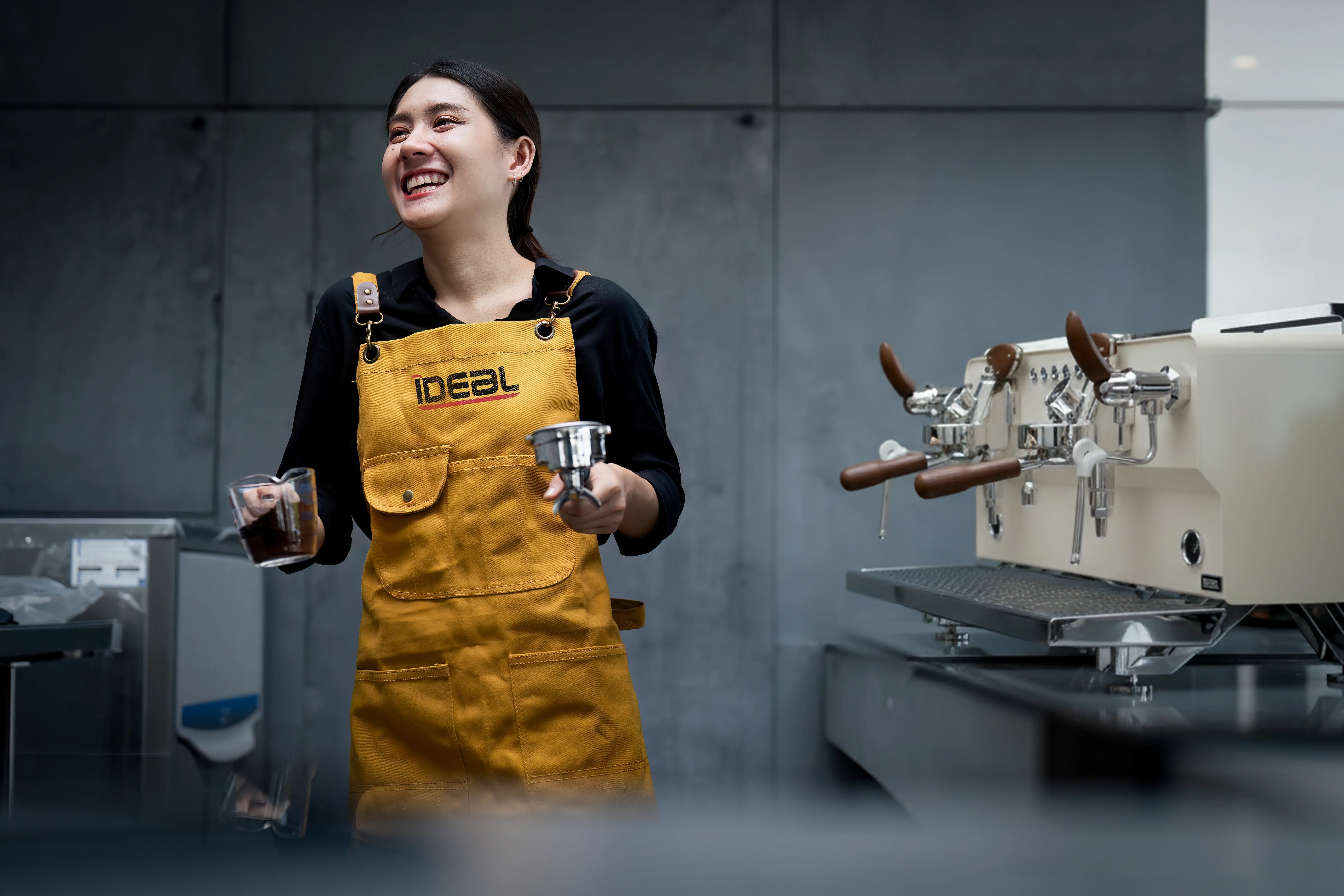 Barista brewing espresso
